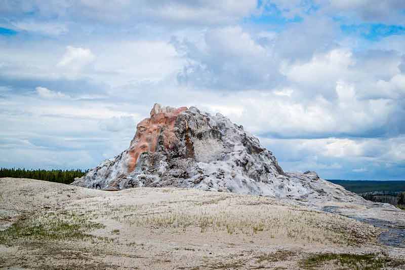 national parks wyoming A conspicuous cone type geyser in the preserve national forest
