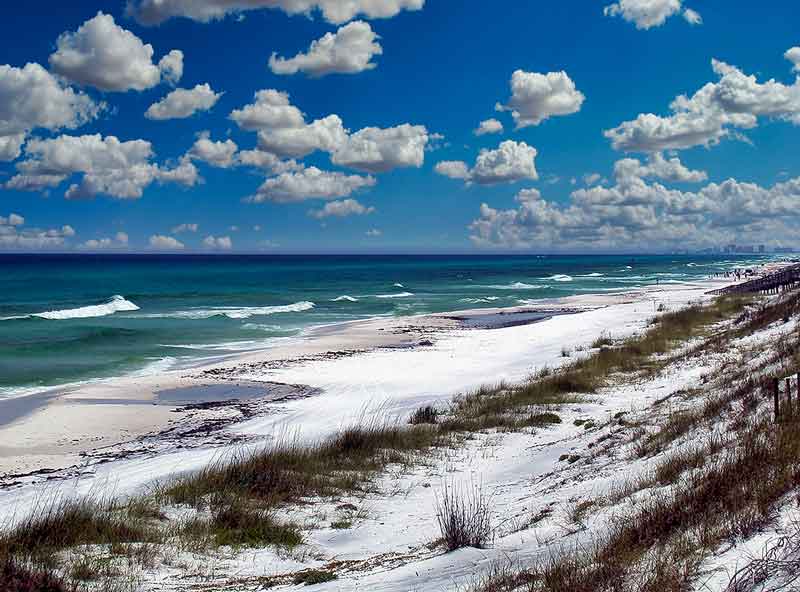 navarre beach covered in snow with a blue sky day