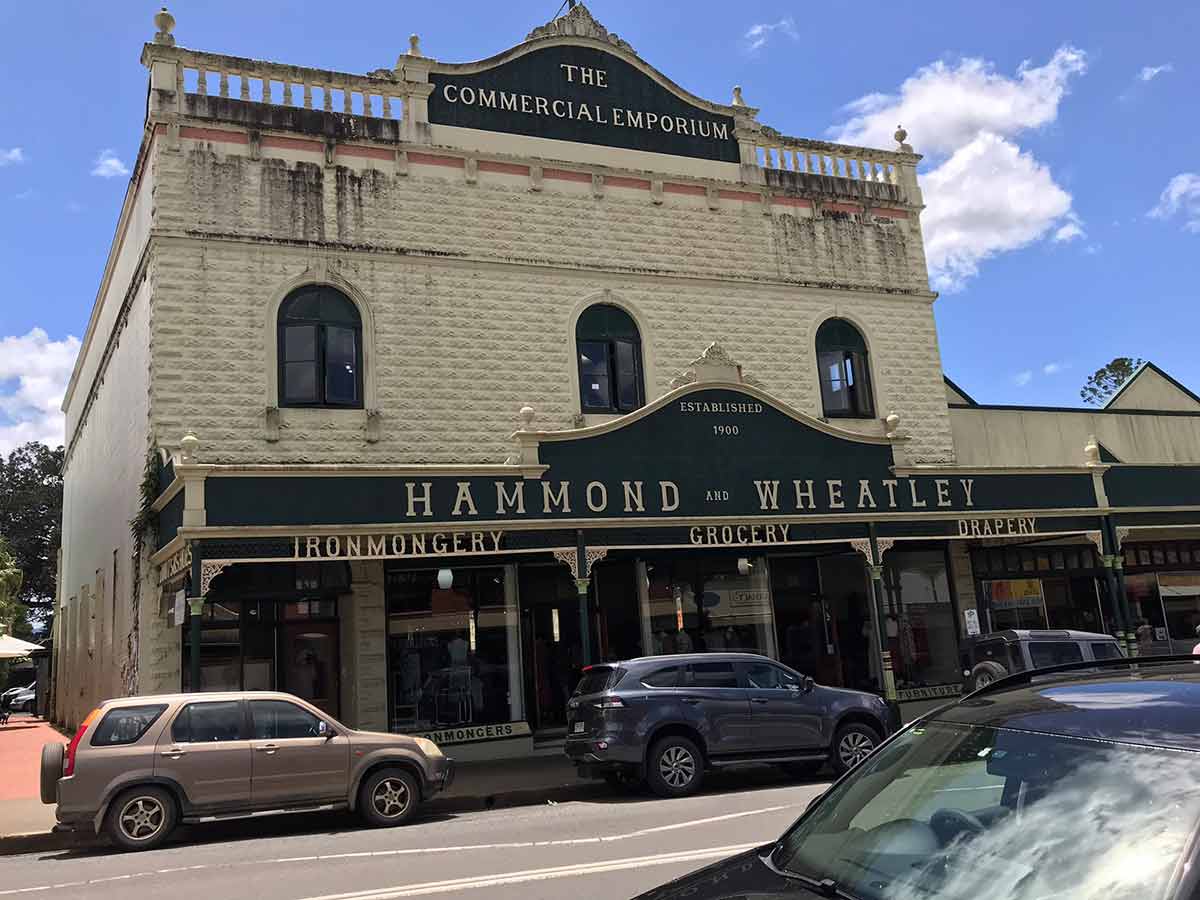Hammond and Wheatley commercial emporium with cars parked outside