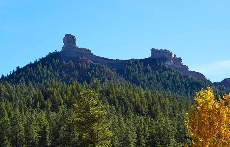 view up a mountain to Chimney Rock