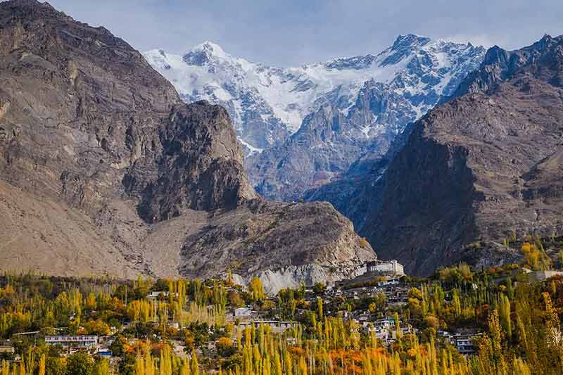 pakistan natural landmarks Autumn scene in Hunza valley with a view of Baltit fort and snow capped Ultar sar mountain in Karakoram range