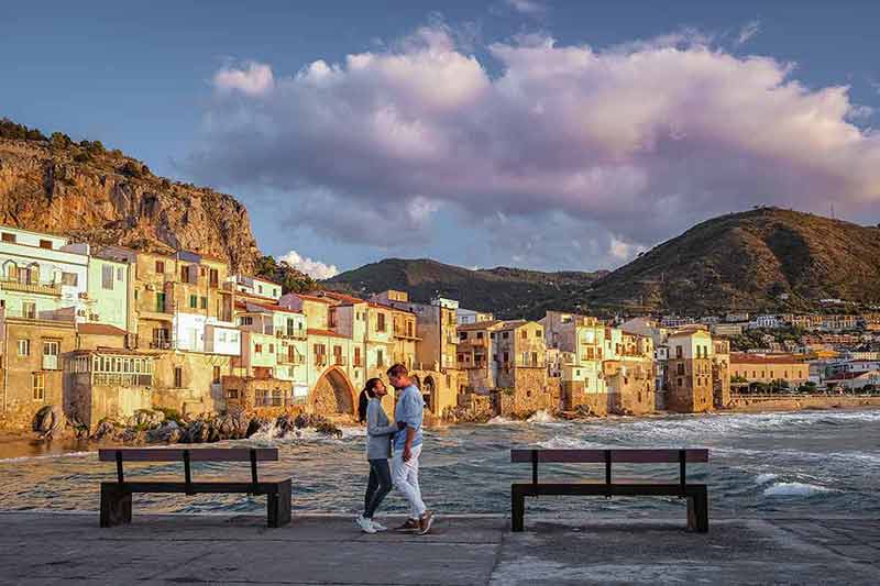 palermo sicily beaches a couple on vacation standing in front of the sea
