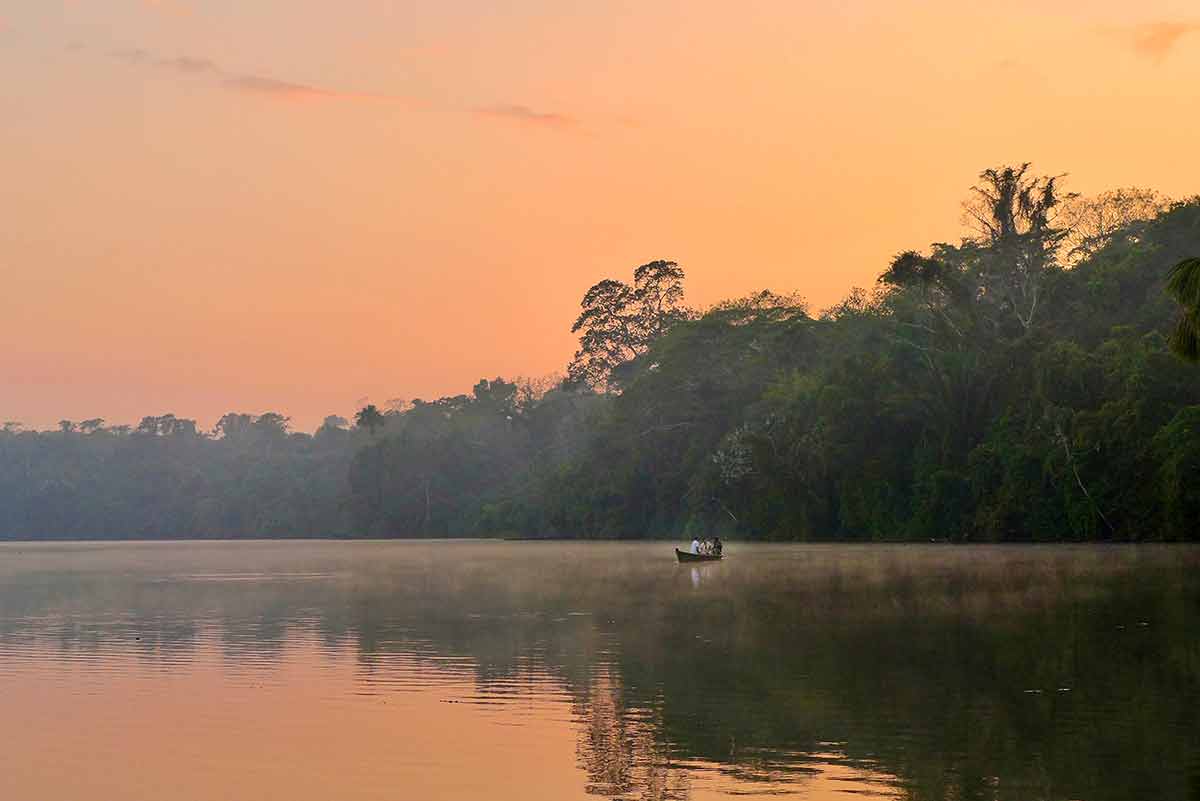 Lake Sandoval At Hazy Sunset In The Peruvian Amazon
