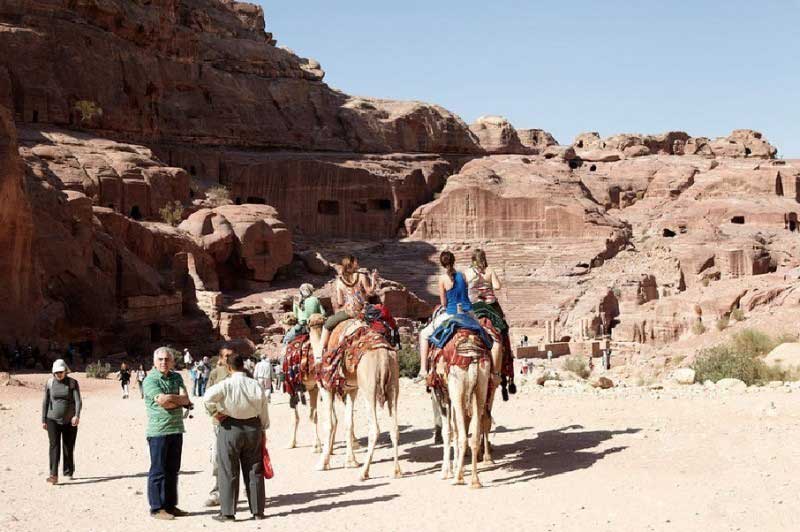 Kids on camels in Petra