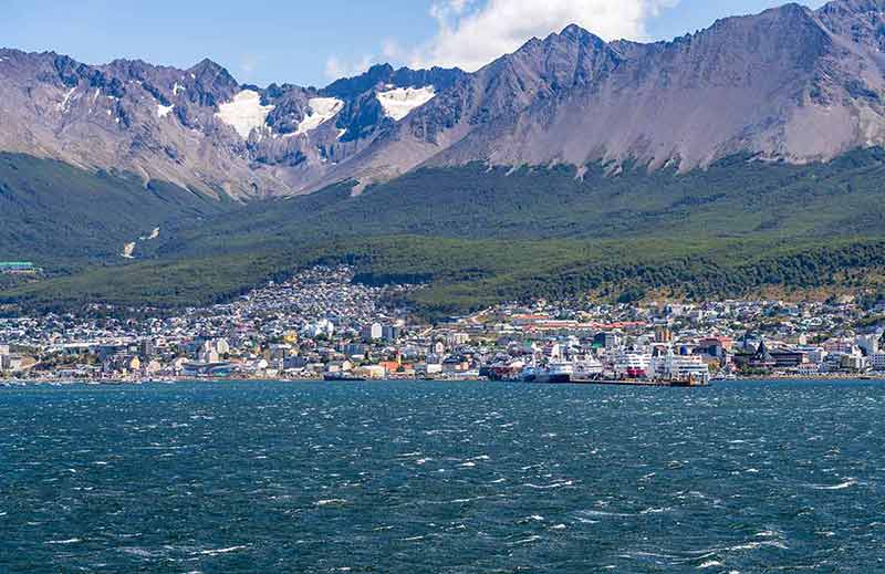 City Of Ushuaia In Argentina With Cruise Ships At Harbor