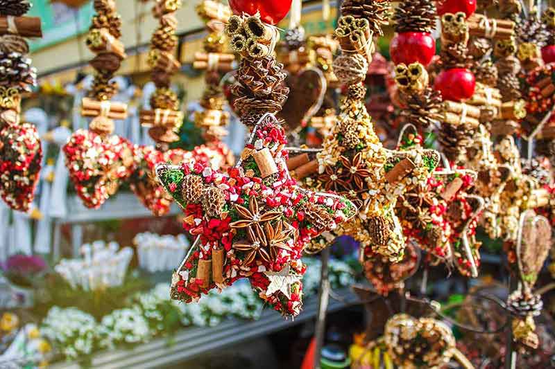 Hand-made Christmas decorations made from anise, cinnamon, cones and dried fruit.