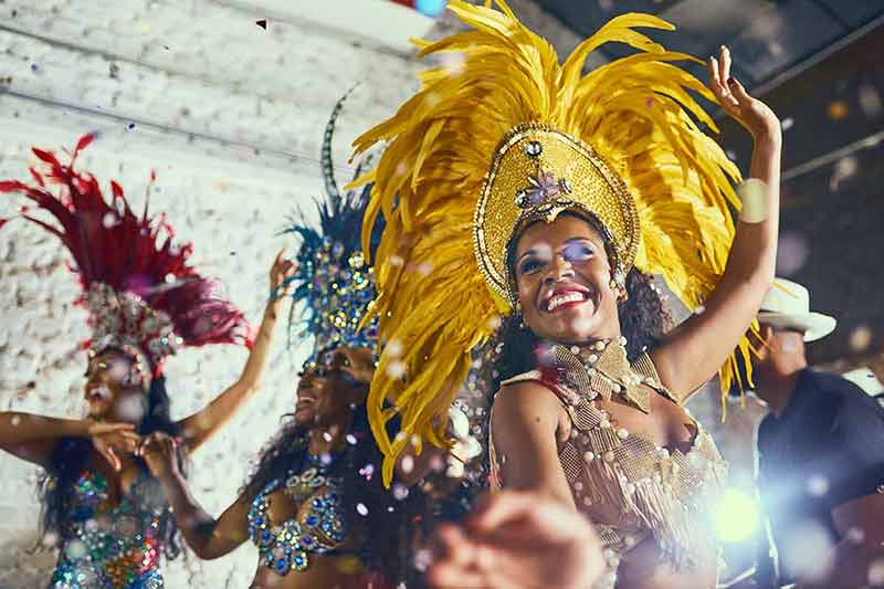rio brazil at night colourful feathered headresses and costumes