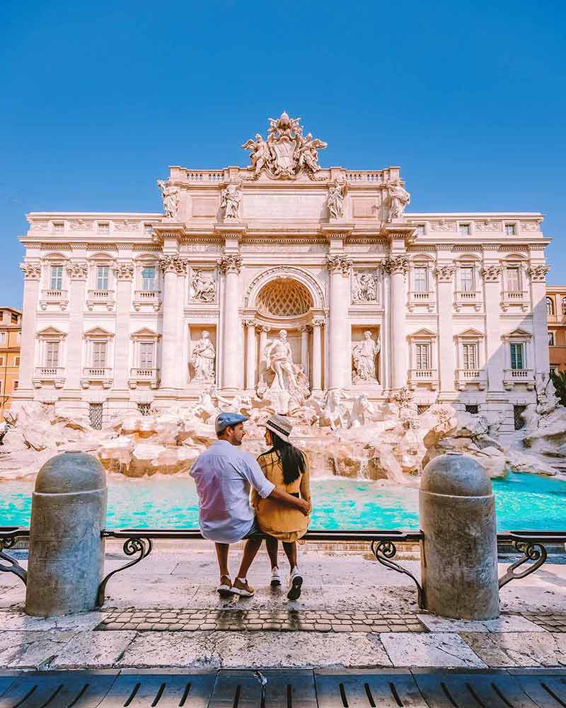 rome italy landmarks Young couple mid age on a city trip in Rome Italy, Europe, couple sightseeing, visit Fontana di Trevi in Rome Italy
