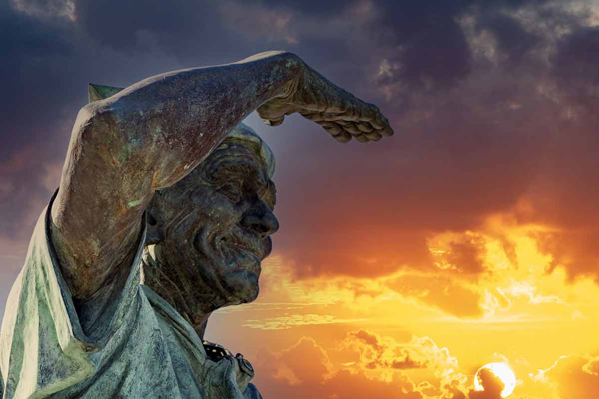 sailor statue malecon la paz with fiery sky at sunset