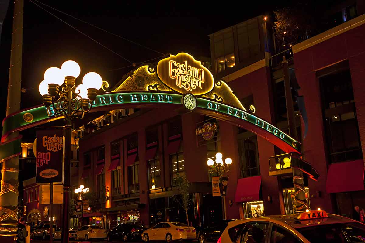 san diego city landmarks sign at the entrance to the Gaslamp Quarter at night