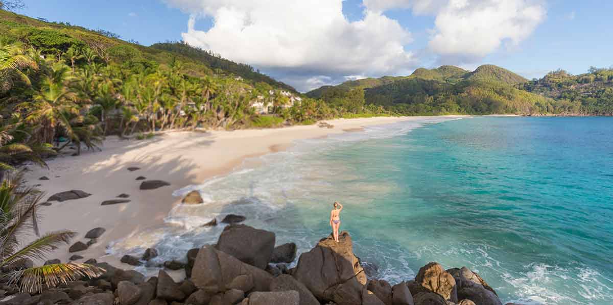 seychelles beach mahe island woman standing on rocks