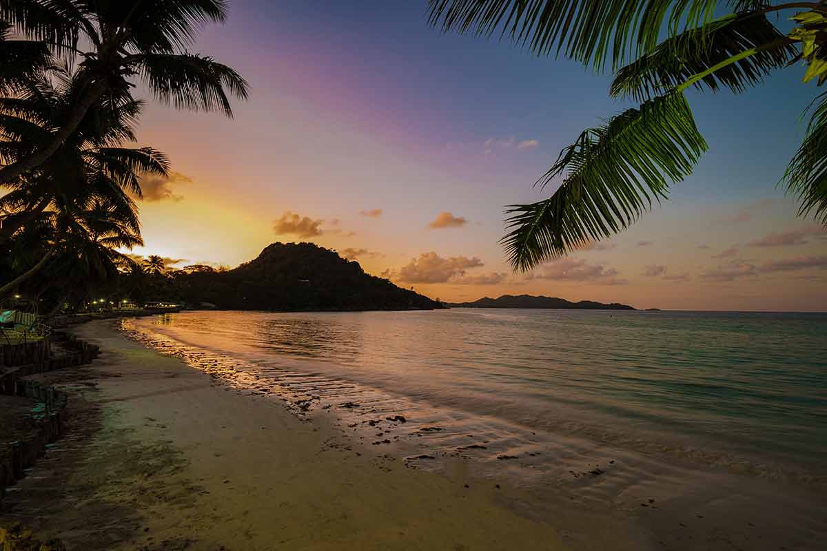 seychelles beaches background sunset over the beach