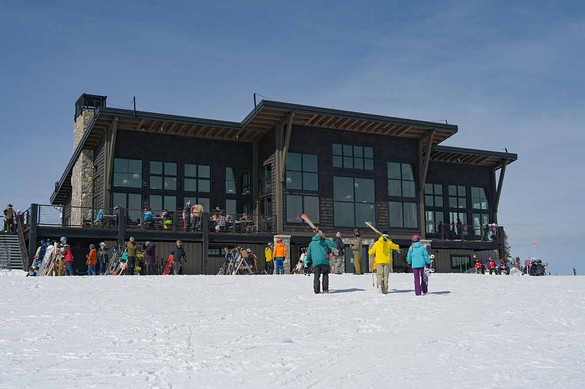 ski resorts idaho schweitzer skyhouse skiers in front of the skyhouse