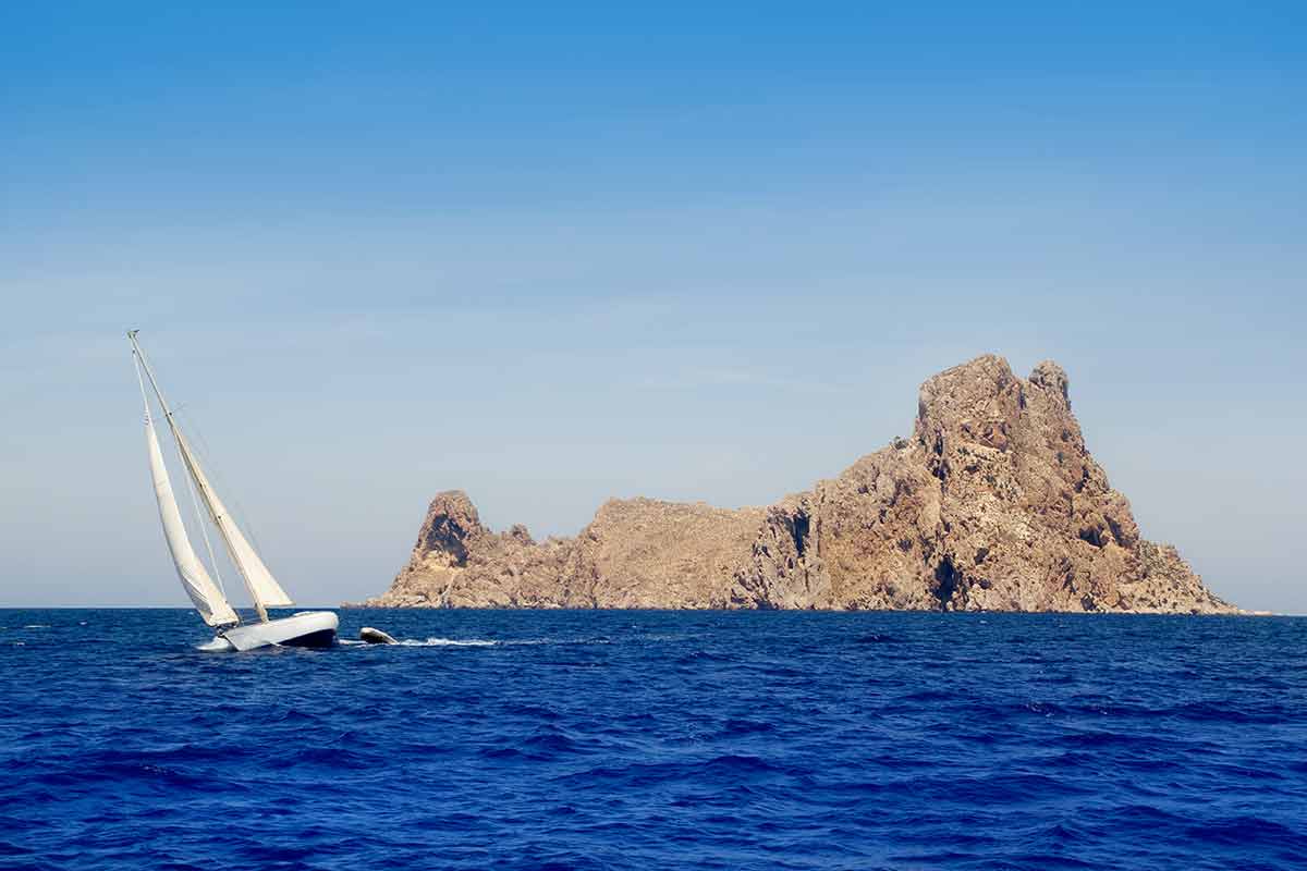 sober things to do in ibiza Ibiza sailboat in Es Vedra island at Mediterranean blue sea