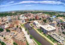 20 South Dakota Cities And Towns Beyond Mount Rushmore aerial view of sioux falls city and river