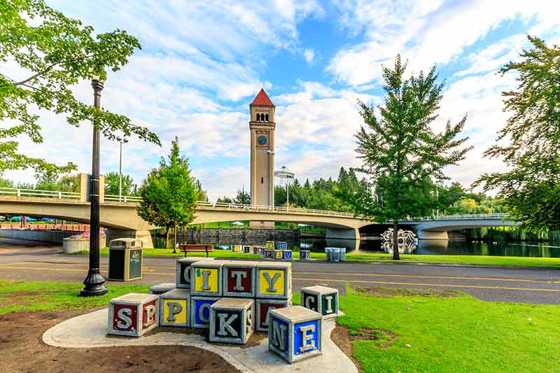 spokane blocks speling out the name of the city and clock tower in the background