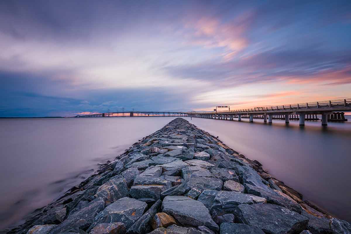 stone wall and bridge at Sandy Point State Park at dusk