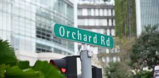 Orchard Road Sign And Buildings