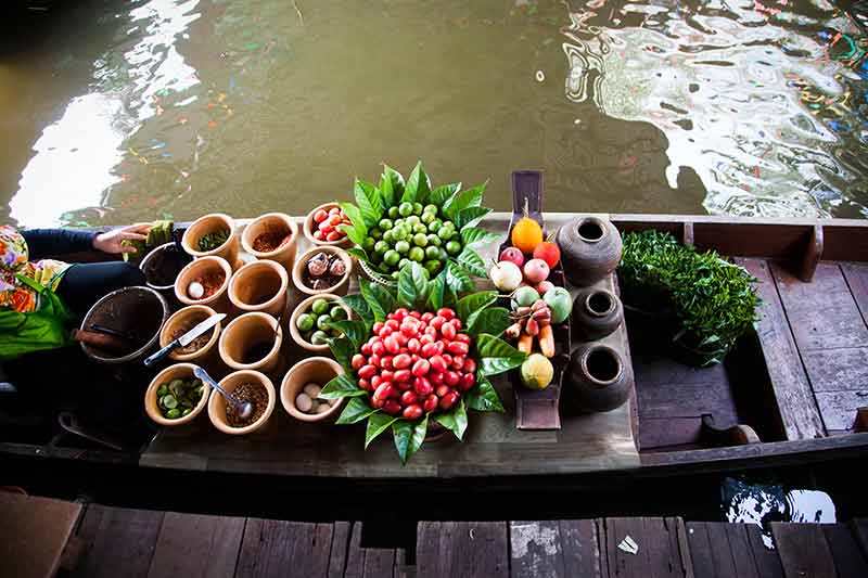 a delicious display of condiments at Talingchan floating markets Bangkok