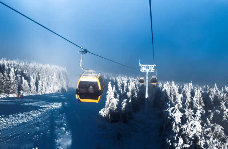 20 things to do in Telluride that feel like a movie Gondolas rises in the mountains, ski resort, snow covered Christmas trees, winter landscape