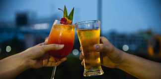thai alcoholic drinks Couple celebration in restaurant with soft drink beer and mai tai or mai thai