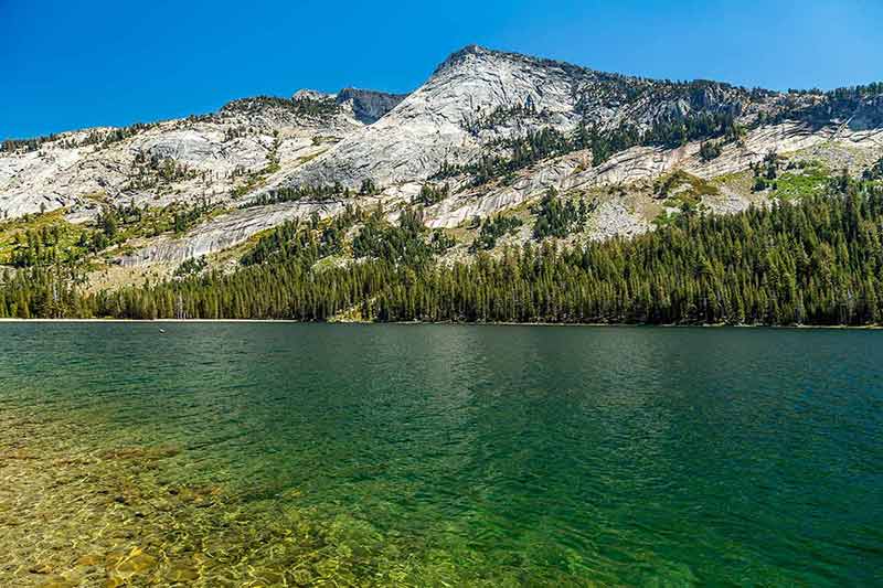 things to do and see in yosemite national park snow-sprinkled mountains of Tenya Lake