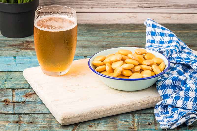 things to do at night in orlando for adults glass of beer and nuts on a wooden board