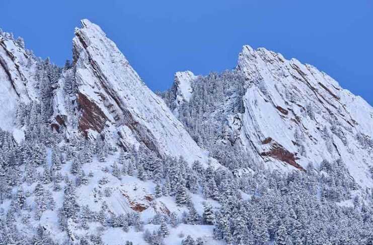 20 things to do in Boulder CO that will make you want to move there flatirons covered in snow in winter
