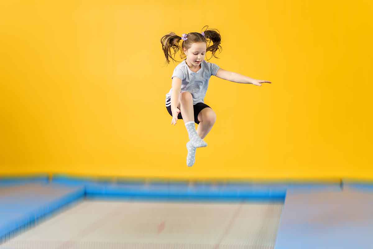 things to do fayetteville for kids little girl with pony tails jumping on trampoline