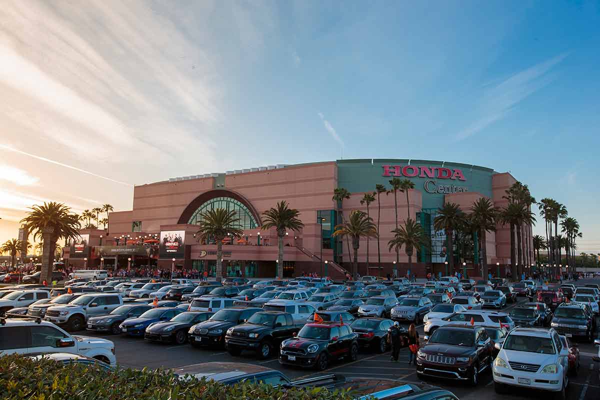 things to do in anaheim besides disneyland cars parked outside the Honda Center at dusk