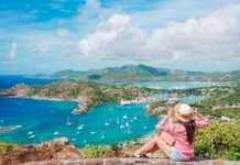 Woman admiring the View Of English Harbor From Shirley Heights, Antigua