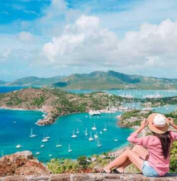Woman admiring the View Of English Harbor From Shirley Heights, Antigua