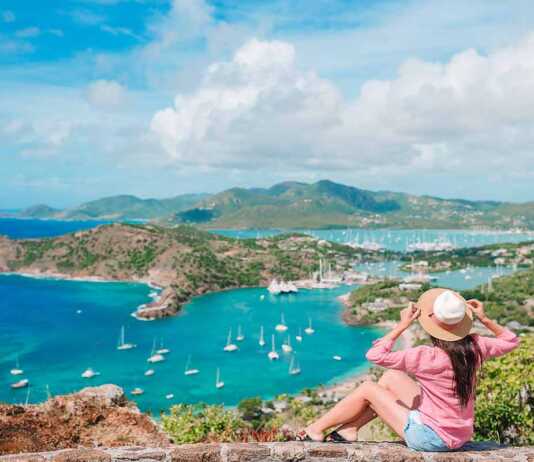 Woman admiring the View Of English Harbor From Shirley Heights, Antigua