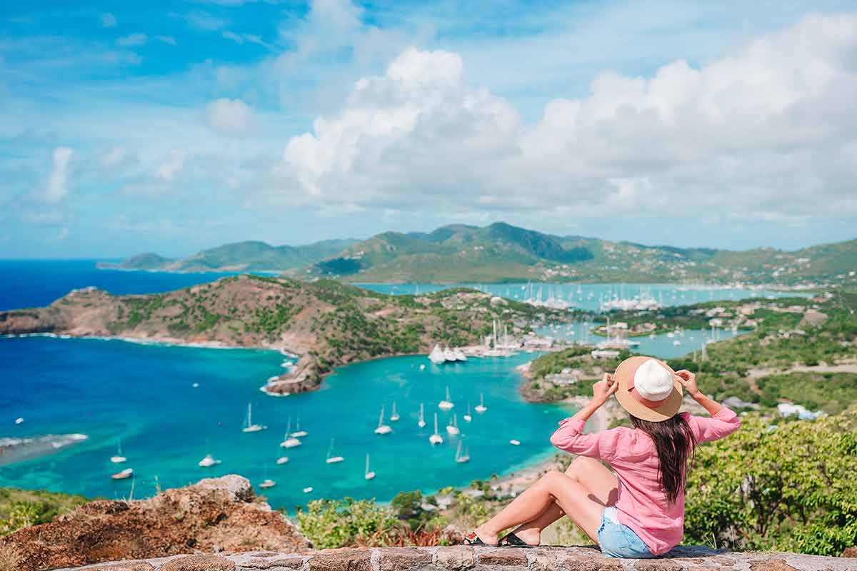 Woman admiring the View Of English Harbor From Shirley Heights, Antigua
