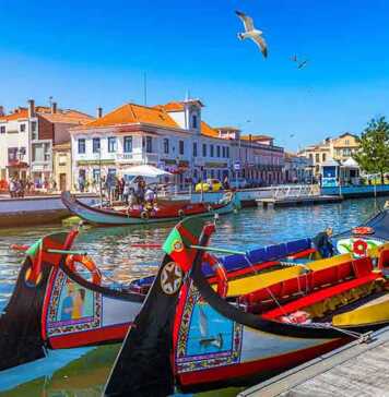 Traditional Boats On The Canal In Aveiro, Portugal