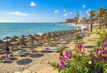 deck lounges and umbrellas on benalmadena beach