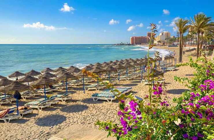 deck lounges and umbrellas on benalmadena beach