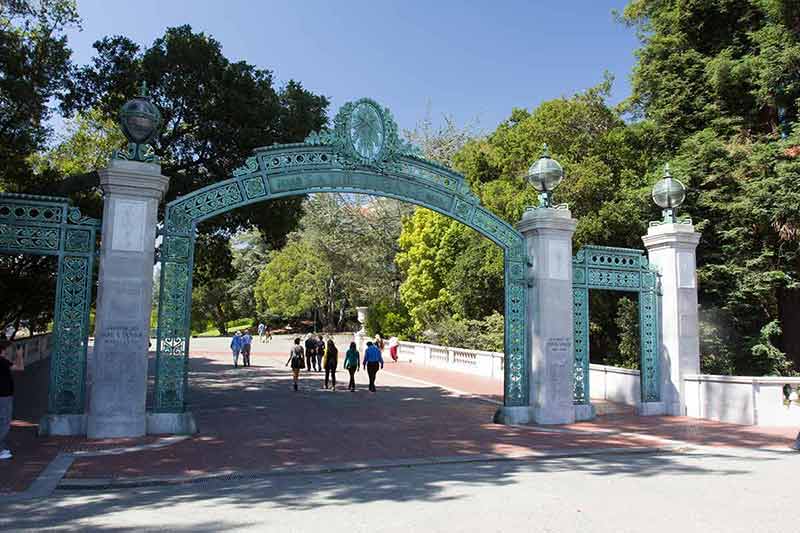 things to do in berkeley this weekend People walking beneath the Sather Gate