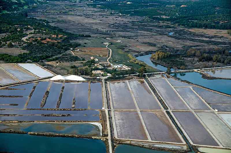 Aerial view of the seawater ponds which slowy evaporate in the Portuguese sunshin