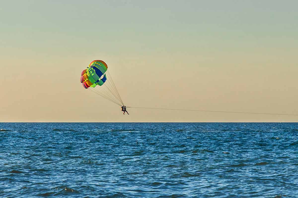 Man And Woman Tourists Are Flying On Parasailing