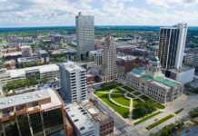 20 Things To Do In Fort Wayne That Are Actually Fun things to do in fort wayne today Image of Aerial shot of Downtown Fort Wayne with several high rise buildings and the courthouse with green courtyard centered.