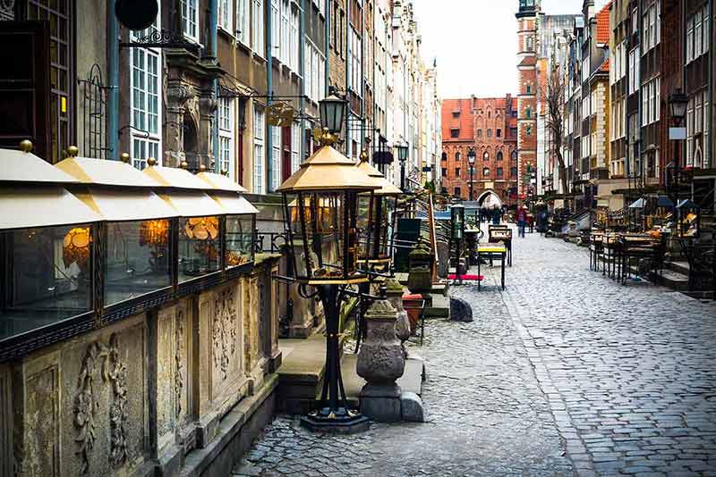 things to do in gdansk in december cafes along either side of the cobblestone street