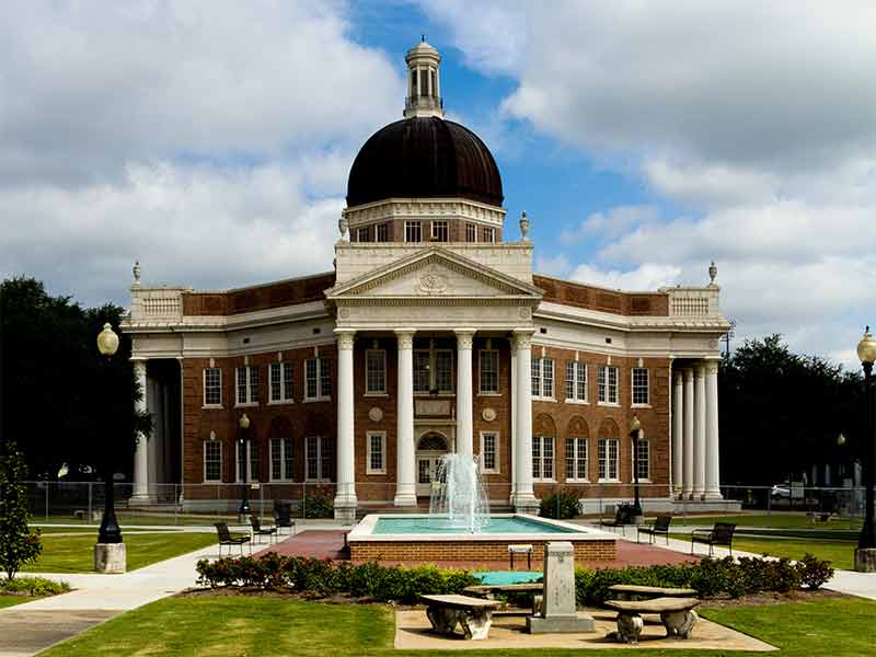 historic building with grey dome and fountain