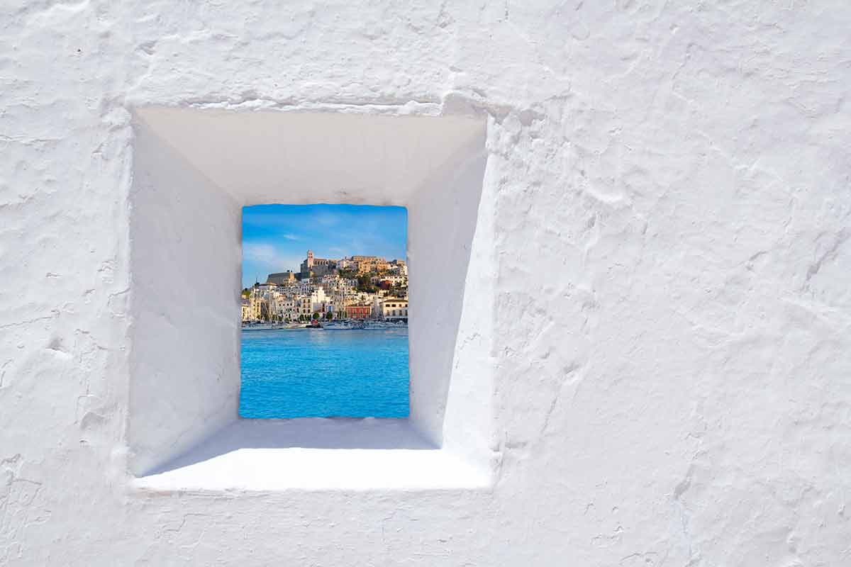 things to do in ibiza Ibiza Mediterranean white wall, window with Eivissa town view