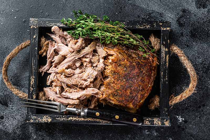 things to do in idaho springs, co pulled pork dish in a black wooden serving tray