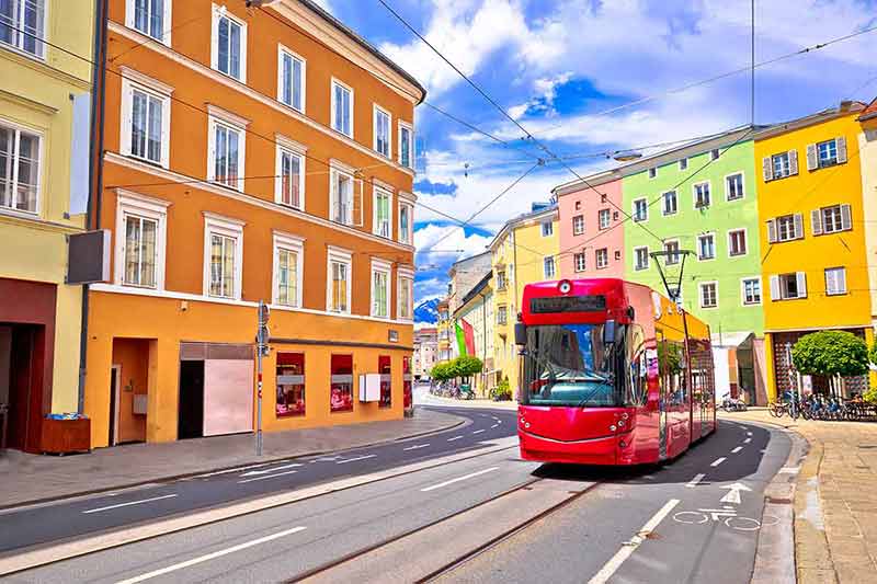 things to do in innsbruck austria colourful buildings with red tram