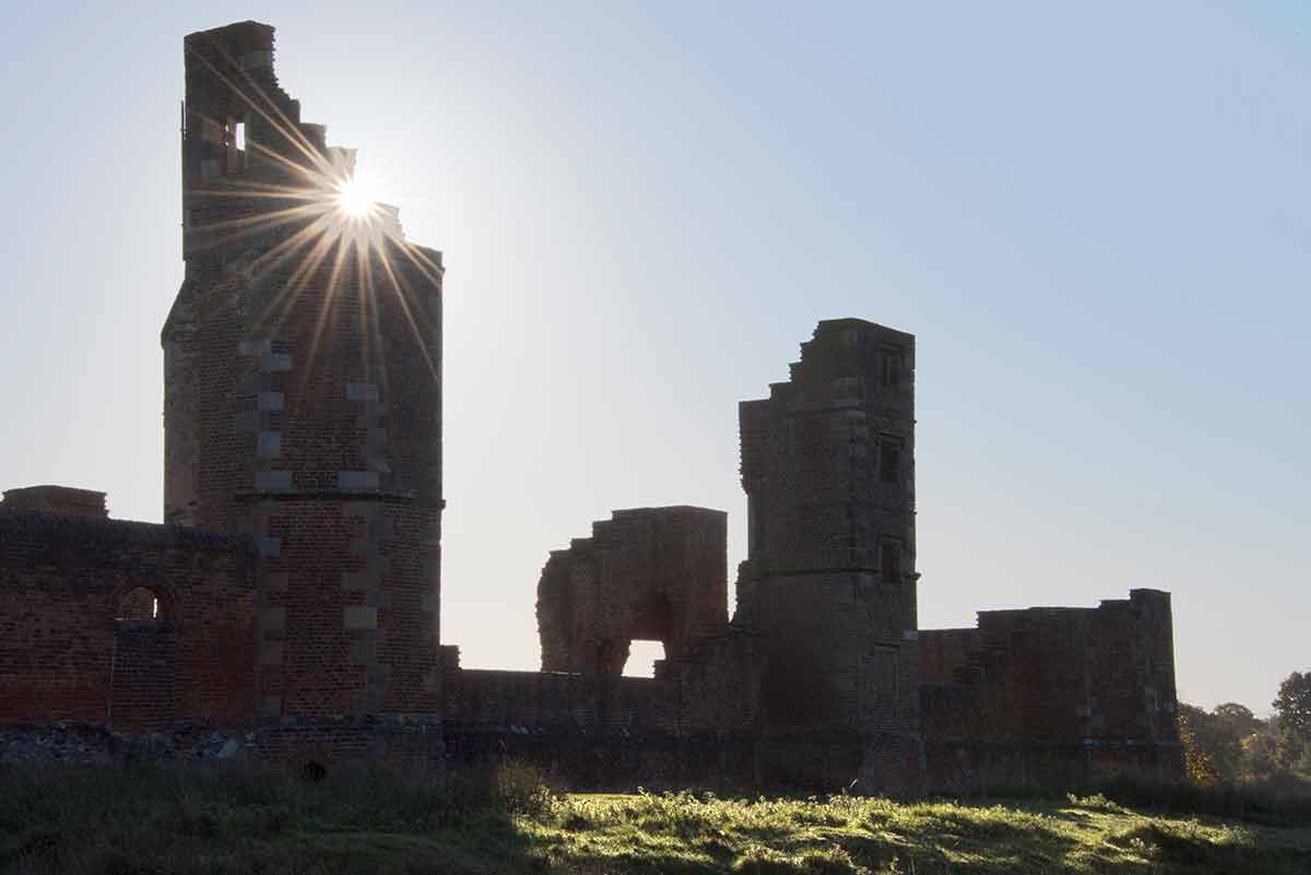 things to do in leicester ourdoors Bradgate Park ruins with sun streaming through