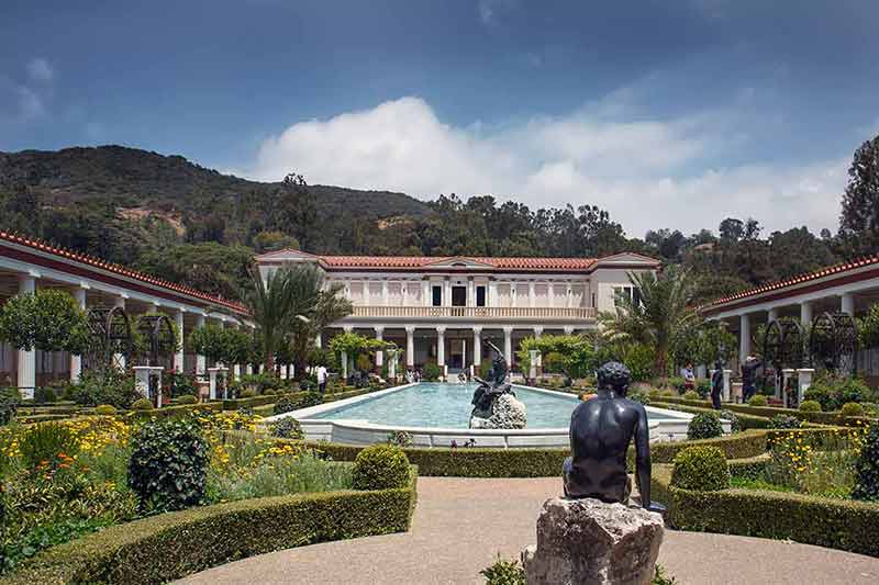 things to do in malibu with kids manicured garden and fountain in front of the villa