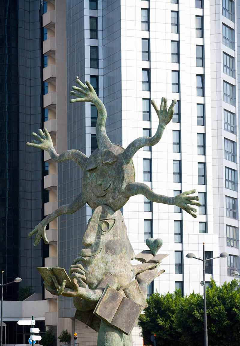 public statue in front of a building
