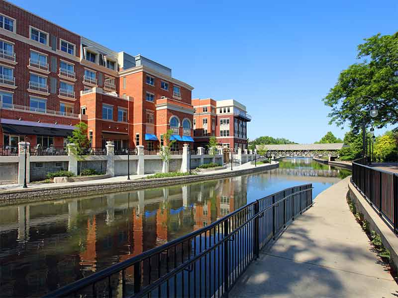 things to do in naperville downtown red brick building, canal and pathway